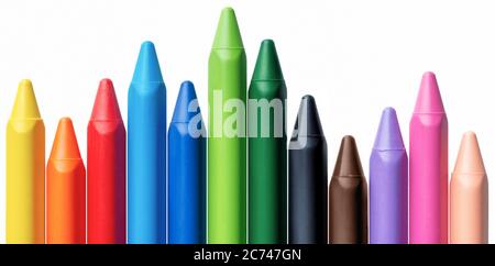 Assorted set of bright multicolored crayons arranged as histogram or bar chart, isolated on white background Stock Photo