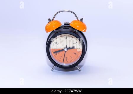classical alarm clock ringing on white background. High resulotion image. Stock Photo