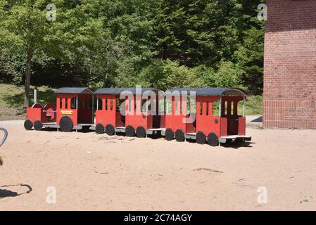 Cologne, Germany. 13th July, 2020. A train for children is placed as a play equipment on a playground. Credit: Horst Galuschka/dpa/Alamy Live News Stock Photo