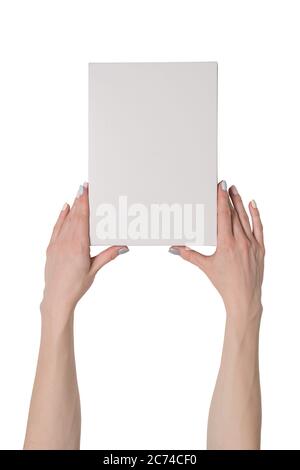 White rectangular box in female hands. Top view. Isolate Stock Photo