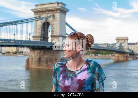 Young woman posing at Chain Bridge, Lanchid, Budapest, Hungary Stock Photo