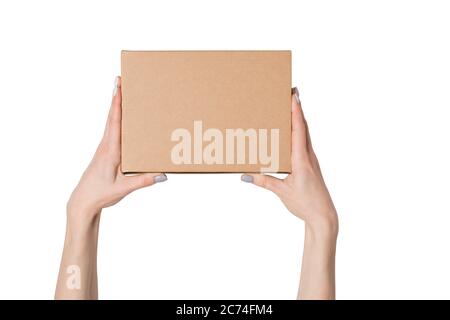 Rectangular box in female hands. Top view. Isolate Stock Photo