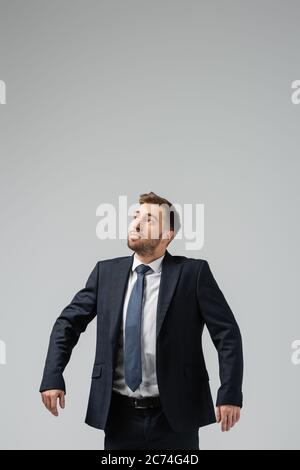 businessman marionette in suit isolated on grey Stock Photo