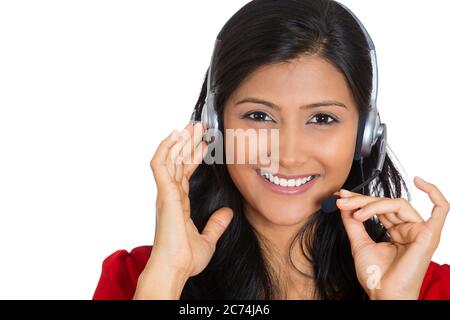 Portrait of a smiling female customer representative with phone headset chatting on line with client isolated on white background. Stock Photo