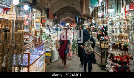 Isfahan, Iran - May 2019: Grand bazaar of Isfahan, also known as Bazar Bozorg with tourists and local people shopping, historical market Stock Photo