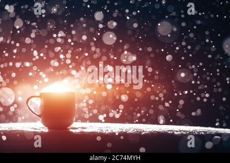 Hot Coffee cup on a frosty winter day window background