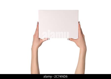 White rectangular box in female hands. Top view. Isolate Stock Photo