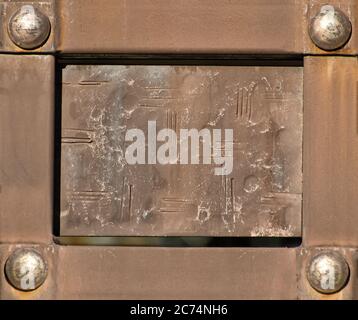 Vintage rectangular plate in metal frame with rivets. Stock Photo