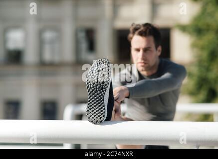 Portrait of sports man stretching his muscular before workout Stock Photo