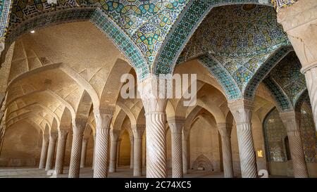 Shiraz, Iran - May 2019: The prayer hall of Vakil Mosque with columns. Vakil means regent, title of Karim Khan, founder of Zand Dynasty. Stock Photo