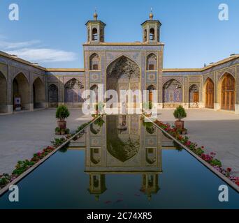 Shiraz, Iran - May 2019: Courtyard with pool of Nasir al-Mulk Mosque in Shiraz Stock Photo