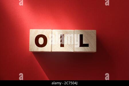 word OIL on cube blocks on red. World Economics business concept Stock Photo