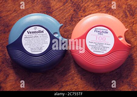 Blue Ventolin asthma reliever and orange Flixotide preventer accuhalers or inhalers Stock Photo