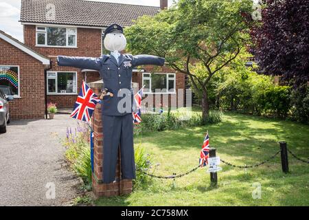 Novelty scarecrow on display outside house during annual scarecrow festival in village of Holwell, near Hitchin, Hertfordshire. Stock Photo