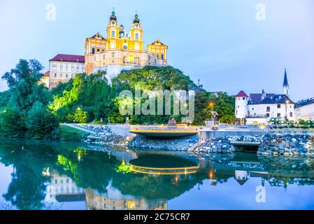Melk Abbey, German: Stift Melk, reflected in the water of Danube River by night, Wachau Valley, Austria. Stock Photo
