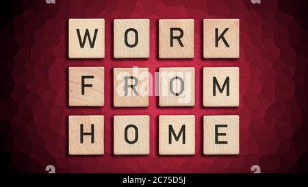 Work from home written with wooden tiles over red background. Quarantine measures for Covid-19 require isoliation and work from home. Virus Pandemic P Stock Photo