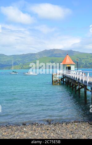 The most French town in New Zealand, Akaroa will have you entranced with its historic buildings, magnificent harbour and passion for fine food. Stock Photo