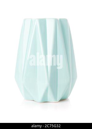 Decorative ribbed vase of turquoise color on a white background. Stock Photo