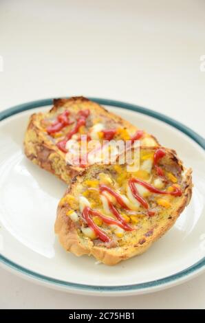 Toast with cheese, mayo and tomatoes sauce. Stock Photo