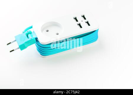 Extension Socket with USB Port on white background for charging phones and electronic devices, blue power cord. Stock Photo