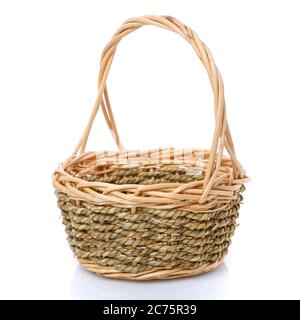 Basket woven from natural vine isolated on a white background. Stock Photo