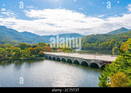 A bridge, water, and autumn colors Stock Photo