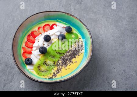 Flat Lay Of Mango Smoothie Bowl On Yellow Background Stock Photo Alamy