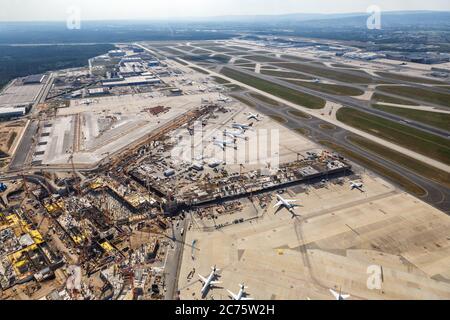 Frankfurt, Germany - May 27, 2020: Terminal 3 Construction Site Frankfurt Airport airplanes aerial view in Germany. Stock Photo
