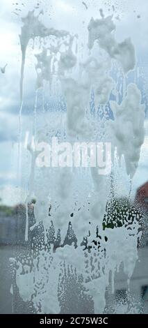chemical soap, detergent or disinfectant, foam on clear glass. Stock Photo