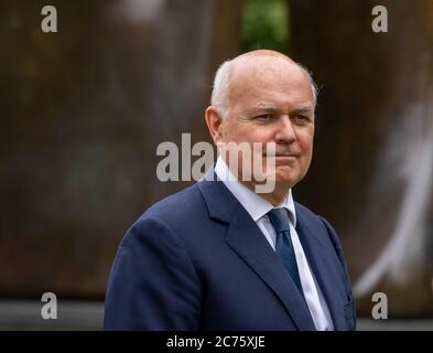London, UK. 14th July, 2020. MP's in Westminster, Iain Duncan Smith Conservative MP for Chingford and Woodford and former leader of the Conservative party. He is pictured on College Green Westminster giving an interview on the Huawei UK 5G ban, Credit: Ian Davidson/Alamy Live News Stock Photo