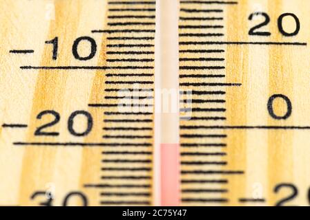A macro shot of a classic wooden thermometer showing a temperature -20 degrees Celsius, -4 degrees Fahrenheit. Stock Photo