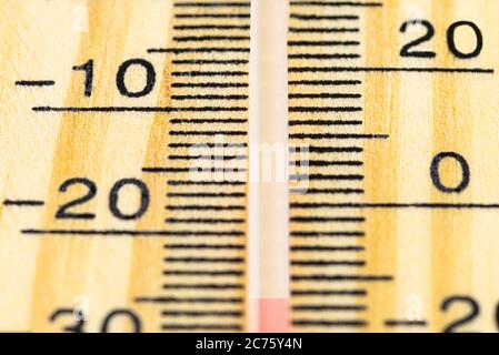 A macro shot of a classic wooden thermometer showing a temperature -25 degrees Celsius, -13 degrees Fahrenheit. Stock Photo