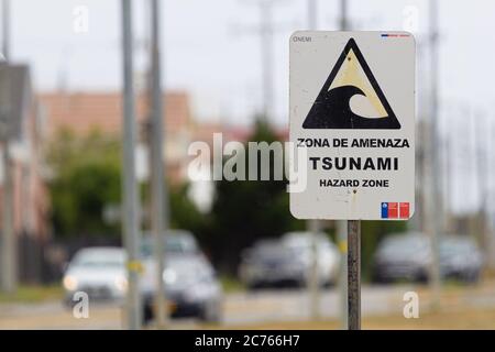 PUNTA ARENAS, CHILE - January 2020: Sign of Tsunami Alert - Hazard Zone Stock Photo