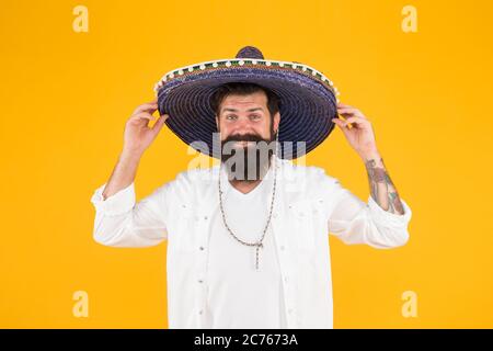 mexican party concept. travel to mexico. celebrate traditional mexican holiday. fest and holiday sales. cinco de mayo mexican celebration. bearded man in sombrero and poncho. Stock Photo