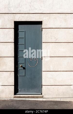 Front door with drawn smiley face, Richmond, Surrey Stock Photo