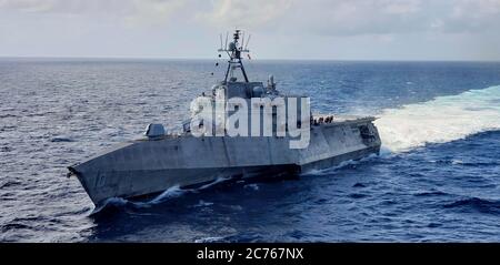 The U.S. Navy Independence-variant littoral combat ship USS Gabrielle Giffords during a presence patrol in international waters December 21, 2019 in the South China Sea. Stock Photo