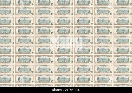 10 US dollars bills printed in money production conveyor. Collage of many bills. Concept of currency inflation and devaluation Stock Photo