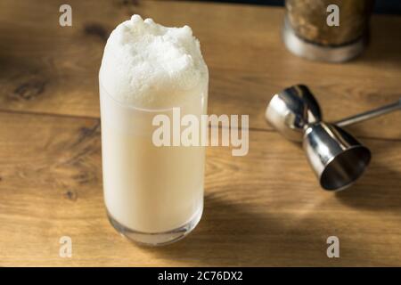 Homemade Frothy Ramos Gin Fizz Cocktail with Cream Stock Photo