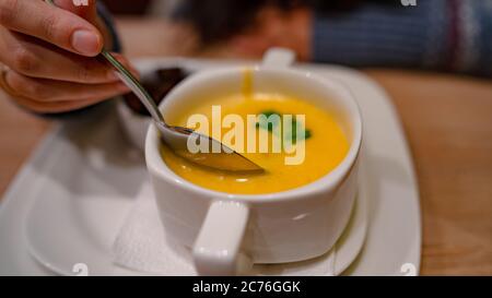 Cheese cream soup on the table in the cafe Stock Photo