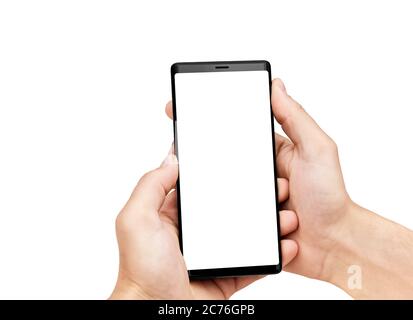 Close up of man's hands holding mobile smart phone with blank copy space screen, isolated on white background. Image of man using his mobile phone. Stock Photo