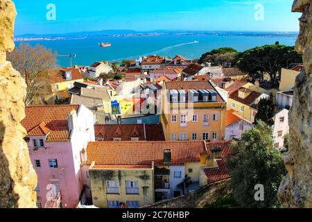 Scenic high angle view of Lisbon cityscape and the Atlantic ocean from Castelo de São Jorge, Lisbon, Portugal. Stock Photo