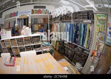 Women shopping for upholstery fabric Stock Photo