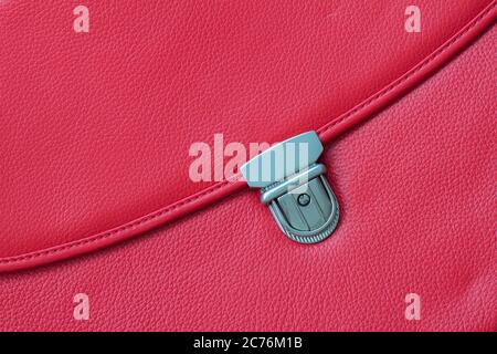 Close-up texture of briefcase, handbag from genuine leather with metal buckle or clasp lock. For background , backdrop Stock Photo