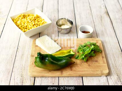 Organic whole ingredients ready for preparing gourmet Mexican Street Corn Salad for Cinqo de Mayo family celebration party using fresh healthy foods Stock Photo