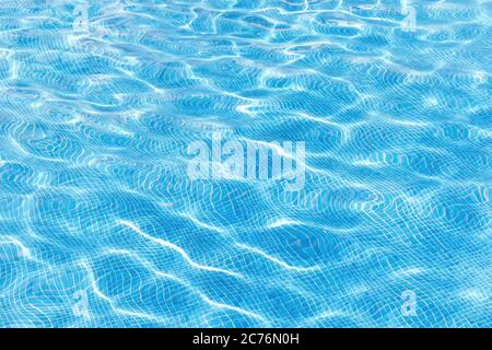 Blue swimming pool rippled water background Stock Photo