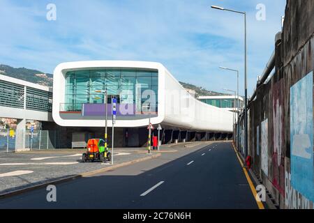 Airport terminal building of modern architecture, passage, electromobile and asphalt entry road, Funchal, Madeira island, Portugal Stock Photo