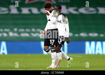 Derby County's Jayden Bogle (left) appears dejected after the final whistle during the Sky Bet Championship match at the Cardiff City Stadium. Stock Photo