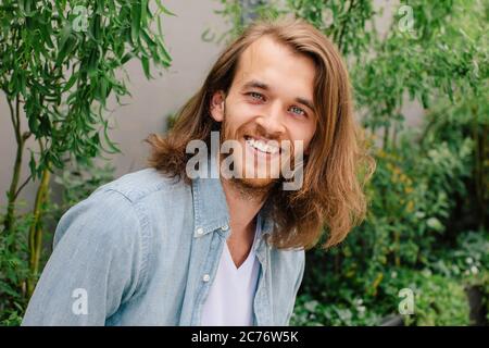 Portrait of a handsome man with long hair Stock Photo