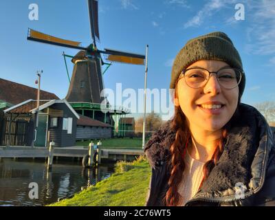 woman winter tourist holiday in zaanse schans in netherlands Stock Photo