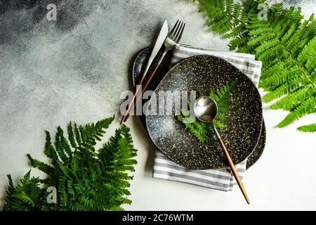 Summer place setting with fern leaves Stock Photo